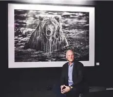  ?? Arshad Ali/Gulf News ?? Paul Nicklen delivers the keynote address on ‘Polar Obsession’ during the opening session of Xposure 2017.