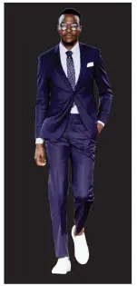  ?? Picture: SDR ?? Right: A model shows off a slim suit worn with sneakers.