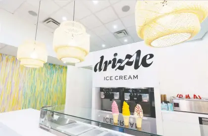  ?? IAN KUCERAK ?? Drizzle Ice Cream is a new soft-serve ice cream shop at 10322 81 Ave. N.W. in Edmonton. Among the flavours available are strawberry cream Belgian chocolate dip, orange sherbet Belgian chocolate dip and Love U Berry Much raspberry cheesecake. Drizzle opened on Canada Day.