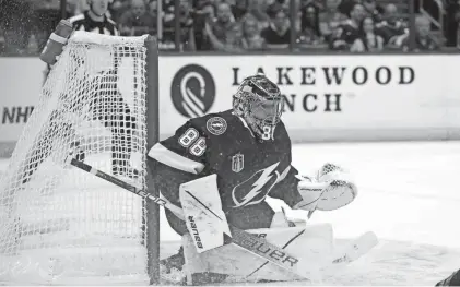  ?? PHELAN M. EBENHACK/AP ?? Lightning goaltender Andrei Vasilevski­y protects the net during Game 3 of the Stanley Cup Final against the Colorado Avalanche on Monday in Tampa, Fla. The Lightning won the game and trail the series 2-1.