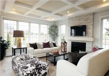  ?? PHOTOS: JULIE OLIVER/OTTAWA CITIZEN ?? A spacious family room with coffered ceiling and wide-plank hickory flooring blends country and contempora­ry.