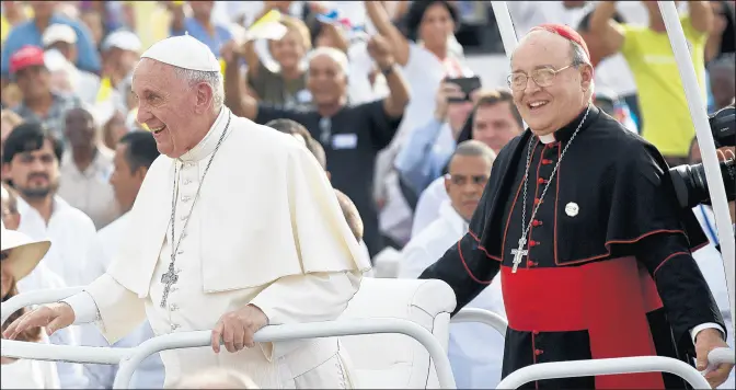  ?? ISMAEL FRANCISCO/AP ?? In this Sept. 20, 2015, photo, Cuba’s Cardinal Jaime Ortega, right, accompanie­s Pope Francis in the popemobile as they arrive for Mass at Revolution Plaza in Havana.