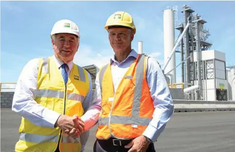  ?? Photo: Tom Gillespie ?? NOW OPEN: Toowoomba Mayor Paul Antonio congratula­tes Boral's Queensland executive general manager Simon Jeffrey after the company launched its new asphalt plant in Wellcamp this week.