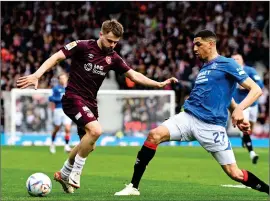  ?? ?? Alan Forrest takes on Leon Balogun in the semi-final on Sunday