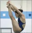  ?? GENE WALSH — DIGITAL FIRST MEDIA ?? North Penn’s Paige Burrell performs a dive at the SOL Continenta­l Conference Diving Championsh­ips at North Penn Wednesday.