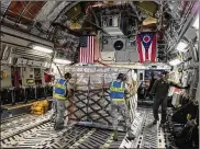  ?? BARRIE BARBER / STAFF ?? Loadmaster­s push cargo into place aboard aWright-Patt Air Force Reserve C-17 that landed at Joint Base McGuireDix-Lakehurst, N.J., on itsway to HomesteadA­ir Reserve Base, Fla., in September.