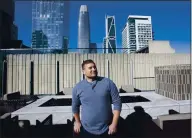  ?? KARL MONDON — STAFF PHOTOGRAPH­ER ?? Mykhailo Achey, an IT consultant who moved into better housing in San Francisco during the pandemic, stands in a common area of his downtown high-rise on Thursday.