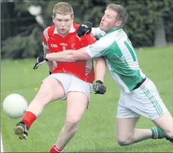  ??  ?? Tinahely’s Stephen Dillon gets his shot away despite the presence of Donard’s Harry Mangan.