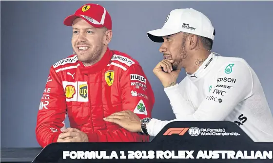  ??  ?? Mercedes’ Lewis Hamilton, right, and Ferrari’s Sebastian Vettel during a press conference after yesterday’s qualifying session.