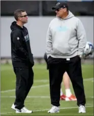  ?? JEFF SINER ?? Carolina Panthers assistant general manager Brandon Beane, left, and head coach Ron Rivera talk during the team’s second session practice of the rookie minicamp earlier this month. The Buffalo Bills hired Beane to fill their general manager vacancy.