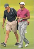  ?? 2011 PHOTO BY STREETER LECKA, GETTY IMAGES ?? Steve Williams, left, was the caddie for Tiger Woods for 13 of Woods’ 14 major titles.