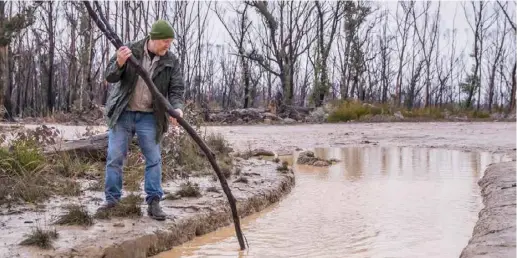  ??  ?? If you're unsure of how deep a mud hole is ... go high-tech and use a stick.