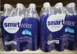  ?? MATT ROURKE — THE ASSOCIATED PRESS FILE ?? In this Thursday file photo, bottles of Smartwater, a Coca-Cola product, are displayed for sale at a supermarke­t in Philadelph­ia.