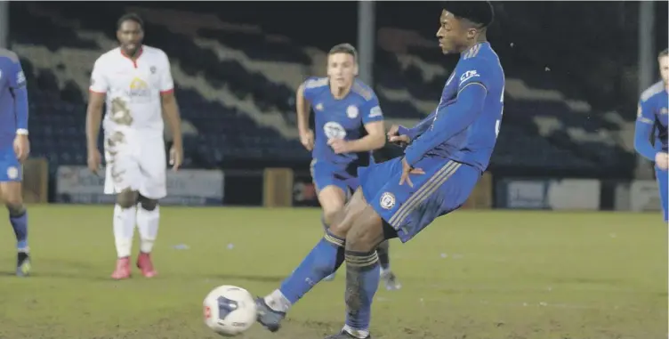  ??  ?? ON THE SPOT: Devante Rodney puts away the winning penalty at The Shay on Tuesday night. Photos: Bruce Fitzgerald.