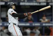  ?? CHRIS O'MEARA — THE ASSOCIATED PRESS ?? The San Francisco Giants' LaMonte Wade Jr. watches his two-run home run off Tampa Bay Rays pitcher Ryan Pepiot during the fifth inning Saturday in St. Petersburg,