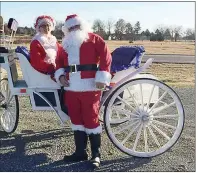  ??  ?? Santa and Mrs. Claus, aka Floyd Spears and Eva Tapp, pose last year with a carriage at the Museum of Veterans and Military History in Vilonia, 53 N. Mount Olive. A Christmas Bazaar is scheduled from 10 a.m. to 4 p.m. Saturday with free carriage rides from 10 a.m. to 1 p.m. Homemade soup, gumbo and chicken and dumplings will be available for $5 per bowl, and jewelry and baked goods will also be sold.