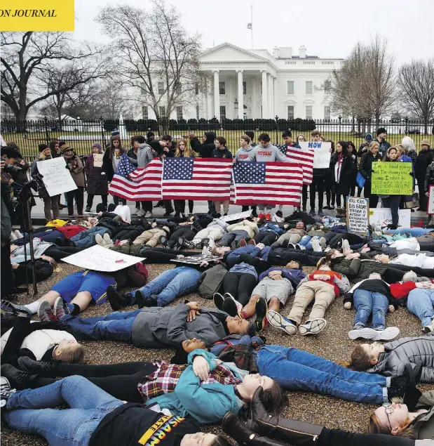  ?? EVAN VUCCI / THE ASSOCIATED PRESS ?? Dozens of teenage demonstrat­ors participat­e in a “lie-in” at the White House on Monday as they call for gun control reform in the United States.