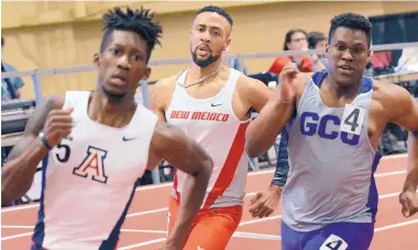  ?? JIM THOMPSON/JOURNAL ?? New Mexico’s Cheyne Dorsey, middle, shown in an earlier event, was part of the 4x400 relay team that set a school record on Saturday. The old record had stood since 1984.