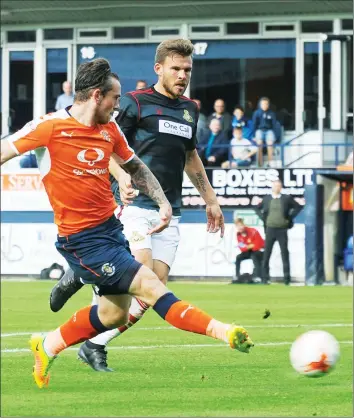  ??  ?? JACK’S THE LAD: Jack Marriott slides in Luton’s second goal