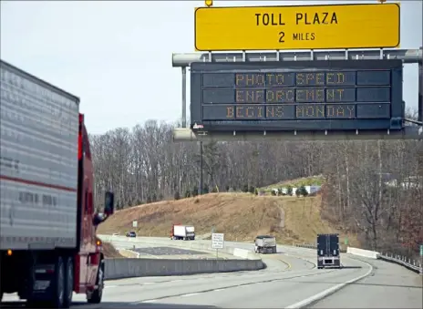  ?? Pam Panchak/Post-Gazette ?? Informatio­nal signs along the westbound Pennsylvan­ia Turnpike announce the upcoming speed enforcemen­t using cameras in work zones and toll plazas in Cranberry. Photo speed enforcemen­t begins Monday.