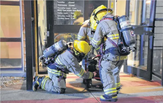  ?? TINA COMEAU ?? Yarmouth firefighte­rs traced the smell of smoke at the Western Branch of the Art Gallery of Nova Scotia in Yarmouth to an overheated motor in the ventilatio­n system. There was no fire and a fan helped to clear the building of smoke. The fire department credited the alarm system for early detection of what could have been a potentiall­y bigger problem.