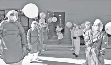  ??  ?? St. Elizabeth Hospital medical staff send off Amor and baby Angela