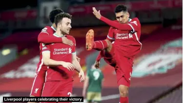  ??  ?? Liverpool players celebratin­g their victory