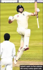  ??  ?? England's captain Joe Root celebrates after scoring a century against Lanka