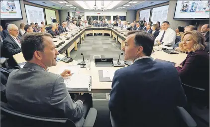  ?? CP PHOTO/FRED CHARTRAND ?? Federal Finance Minister Bill Morneau, centre, along with his Deputy Minister Paul Rochon, left, and Deputy Governor of the Bank of Canada Carolyn Wilkins, right, as they prepare to meet with provincial and territoria­l finance ministers in Ottawa,...