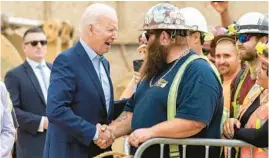  ?? ALEX GALLARDO/AP ?? President Joe Biden shakes hands with Kevin Corbin, a heavy equipment operator, on Thursday in Los Angeles. Biden closed a three-state Western trip Saturday in Oregon.