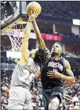  ?? (AP) ?? Houston Rockets’ Clint Capela (right), blocks a shot by Minnesota Timberwolv­es’ Derrick Rose during the first half in Game 1 of a first-round NBA basketball playoff series
on April 15, in Houston.