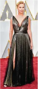  ?? Frazer Harrison / Getty Images ?? Charlize Theron chooses an illfitting Dior gown and slick hair.