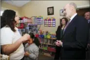  ?? THE ASSOCIATED PRESS ?? Pennsylvan­ia Gov. Tom Wolf talks with Misericord­ia University student and mother Rochelle Jade Scott and her daughter Sky as he visited Misericord­ia University in Dallas, Pa., Friday.