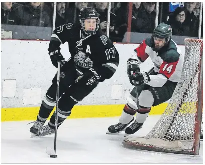  ?? JASON SIMMONDS/TC MEDIA ?? The Charlottet­own Bulk Carriers Pride’s Grant MacAdam carries the puck while bing pursued by Kensington Monaghan Farms Wild forward Zach Thususka during a regular-season game in the New Brunswick/P.E.I. Major Midget Hockey League in Kensington. The...