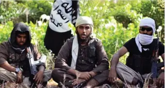  ??  ?? Chilling: British jihadists in a recruitmen­t video aimed at youngsters in the UK