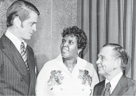  ?? Houston Chronicle file photos ?? U.S. Rep. Charles Wilson, left, and Speaker of the House Carl Albert join in a reception honoring Barbara Jordan at the Rice Hotel in Houston in 1974. Jordan would be only the second woman honored with a city-owned outdoor art installati­on.