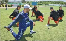  ?? XU JINGXING / CHINA DAILY ?? An Argentine soccer coach trains young Chinese players, affiliated with Beijing Sport University, in Buenos Aires, Argentina, on Sunday.