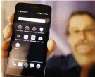  ?? — AP ?? MOUNTAIN VIEW: In this July 30, 2014, file photo, Silicon Valley pioneer and Silent Circle cofounder Jon Callas holds up Blackphone with encryption apps displayed on it at the Computer History Museum in Mountain View, Calif. The Paris terrorist attacks...