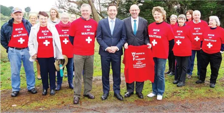  ??  ?? Opposition leader Matthew Guy and Member for Narracan Gary Blackwood (front centre left and right) deliver the news at Drouin East on Friday that an elected Liberal Nationals state government will include funding for a new hospital in its first budget next year to Where’s The Funding community lobby group members (front) Ormond Pearson and Kerry Elliott and (back, from left) Ray Derbyshire, Christine Holland, Glenys Derbyshire, WGHG board chair Jane Leslie, Anne Curtin, Erika McInerney, Joan Kinder, Colleen Tatnell, Liz Daniels, Brian Kennedy and Doreen Westwood.