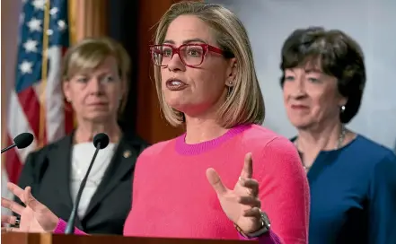  ?? AP ?? Senator Kyrsten Sinema, D-Arizona, flanked by Senator Tammy Baldwin, D-Wisconsin, left, and Senator Susan Collins, R-Maine, speaks to reporters following Senate passage of the Respect for Marriage Act, at the Capitol in Washington yesterday.