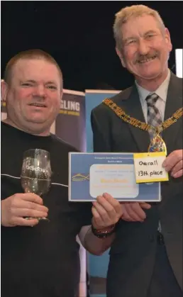  ?? ?? Craig Ogilvie (left) celebrates his success alongside Councillor John Whittle, chairman of East Riding of Yorkshire Council. Image: Sea Angling Adventures