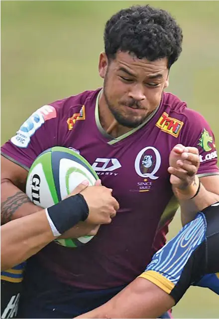  ?? Photo: PA ?? Queensland Reds centre Hunter Paisami tries to break through the Western Force defence during their warm-up match in 2022.