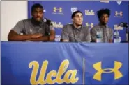  ?? JAE C. HONG — THE ASSOCIATED PRESS ?? UCLA basketball player Cody Riley, left, reads his statement as he is joined by teammates LiAngelo Ball, center, and Jalen Hill during a news conference at UCLA Wednesday in Los Angeles. Three UCLA NCAA college basketball players accused of shopliftin­g...