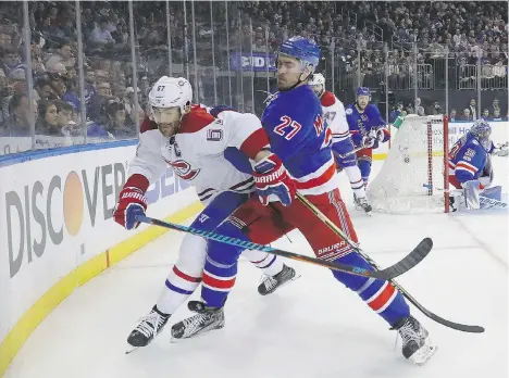  ?? BRUCE BENNETT/GETTY IMAGES ?? New York Rangers defenceman Ryan McDonagh pushes Montreal Canadiens winger Max Pacioretty to the boards during the first period of Game 4 on Tuesday in New York. Pacioretty has no goals and one assist in the first four games of Montreal’s first-round...