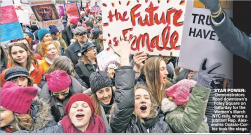  ??  ?? STAR POWER: Demonstrat­ors flood downtown’s Foley Square on Saturday for the Women’s March NYC rally where a jubilant Rep Alexandria Ocasio-Cortez took the stage.