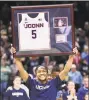  ?? Stephen Dunn / Associated Press ?? UConn’s Crystal Dangerfiel­d holds up her framed jersey.