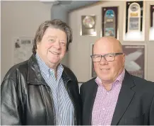  ??  ?? Phil Carson, manager of Foreigner, and Calgary promoter Jeff Parry are the forces behind the creation of the Jukebox Hero musical.