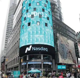  ?? THE ASSOCIATED PRESS ?? The Nasdaq MarketSite sign announces the IPO for DavidsTea Friday in New York. The Montreal-based chain operates 136 locations in Canada and 25 shops in the U.S., and is planning on major growth.