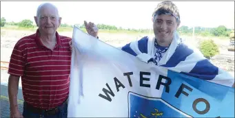  ??  ?? Cork supprter Martin Dennehy consoles Millstreet’s and loyal Waterford supporter Shane Browne