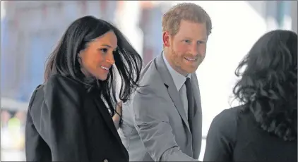  ?? ASSOCIATED PRESS ?? Britain’s Prince Harry and his fiancée Meghan Markle arrive at the Queen Elizabeth II Center during the Commonweal­th Heads of Government Meeting in London, Wednesday, April 18, 2018.